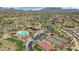 Aerial view of Mountain Bridge showcasing community pool, tennis courts, and desert landscape at 1847 N Red Clf, Mesa, AZ 85207