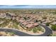 Expansive aerial view of a well-planned community with lush landscaping and tile-roofed homes at 1847 N Red Clf, Mesa, AZ 85207