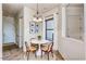 Bright breakfast nook with a round table, light-colored walls, and natural lighting at 1847 N Red Clf, Mesa, AZ 85207