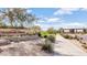 Beautifully landscaped entrance to Mountain Bridge community with stone signage at 1847 N Red Clf, Mesa, AZ 85207