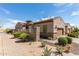 Desert home with low maintenance landscaping, brown garage door, and stone facade accents at 1847 N Red Clf, Mesa, AZ 85207