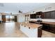 Modern kitchen features granite countertops, dark cabinetry, stainless appliances, open to the living area at 1847 N Red Clf, Mesa, AZ 85207