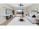 Cozy living room with a fireplace, neutral color palette, and sliding glass doors to the backyard at 1847 N Red Clf, Mesa, AZ 85207