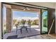 Covered patio with outdoor seating offering a view of the lush backyard at 1847 N Red Clf, Mesa, AZ 85207