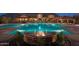 Resort-style community pool with elegant water feature and comfortable lounge chairs at 1847 N Red Clf, Mesa, AZ 85207