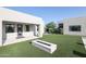Modern home backyard featuring a pristine lawn and a stone fire pit perfect for outdoor entertaining at 1850 E Creek Canyon Rd, Phoenix, AZ 85086