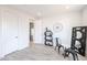 Versatile flex room with natural light, wood floors, and ample space for a home office or additional living area at 1850 E Creek Canyon Rd, Phoenix, AZ 85086