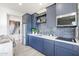 Stylish kitchen featuring navy blue cabinets, modern appliances, and ample counter space for cooking and entertaining at 1850 E Creek Canyon Rd, Phoenix, AZ 85086