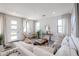 Light-filled living room with comfortable seating, wood floors, and an airy atmosphere, ideal for relaxation at 1850 E Creek Canyon Rd, Phoenix, AZ 85086