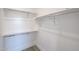 Bright walk-in closet with shelving and chrome bars for hanging garments and convenient storage solutions at 1850 E Creek Canyon Rd, Phoenix, AZ 85086