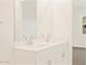 Contemporary bathroom featuring dual sinks, and bright window providing ample light at 19422 N Fiano Dr, Maricopa, AZ 85138