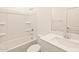 Bright bathroom features a shower-tub combo, white vanity, and modern fixtures at 19422 N Fiano Dr, Maricopa, AZ 85138