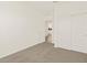Cozy bedroom with neutral carpet, bright walls, and sliding door closet at 19422 N Fiano Dr, Maricopa, AZ 85138