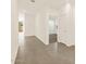 Bright hallway with tile flooring, white walls and a glimpse of the backyard at 19422 N Fiano Dr, Maricopa, AZ 85138