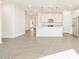 Island kitchen with pendant lights and stainless steel appliances at 19422 N Fiano Dr, Maricopa, AZ 85138