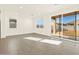 Bright living room featuring large windows, and tiled flooring at 19422 N Fiano Dr, Maricopa, AZ 85138