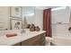 Contemporary bathroom with a shower-tub combination, modern vanity, and stylish decor at 23081 E Saddle Way, Queen Creek, AZ 85142