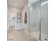 Sleek bathroom featuring a glass-enclosed shower and a tiled floor at 23081 E Saddle Way, Queen Creek, AZ 85142