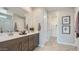 Bathroom featuring a double sink vanity, ample storage, and modern fixtures at 23081 E Saddle Way, Queen Creek, AZ 85142