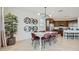 Bright dining room featuring modern lighting, decorative shelving, and a stylish dining set at 23081 E Saddle Way, Queen Creek, AZ 85142