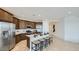 Stylish kitchen featuring stainless appliances, ample counter space, and an island with bar seating at 23081 E Saddle Way, Queen Creek, AZ 85142