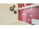 Well-organized laundry room with shelving, and modern hookups at 23081 E Saddle Way, Queen Creek, AZ 85142