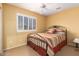 Cozy bedroom featuring a comfy bed, neutral walls, and shuttered window for privacy and light control at 2526 W Florentine Rd, Phoenix, AZ 85086