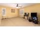 Spacious carpeted bonus room with ceiling fan, shutters and ample room for activities at 2526 W Florentine Rd, Phoenix, AZ 85086
