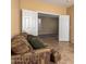 Inviting seating area featuring double doors and views of the adjacent room with tile flooring at 2526 W Florentine Rd, Phoenix, AZ 85086