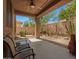 Spacious patio area with desert landscaping and ceiling fan at 2526 W Florentine Rd, Phoenix, AZ 85086