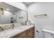 Bathroom with white marble counter, gold faucet and hardware and a decorative sign at 3011 E John Cabot Dr, Phoenix, AZ 85032