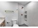 Bathroom featuring a toilet, walk-in shower with niche and gold hardware at 3011 E John Cabot Dr, Phoenix, AZ 85032