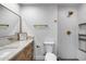 Modern bathroom with a white marble vanity and gold fixtures at 3011 E John Cabot Dr, Phoenix, AZ 85032