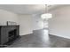 Grey tiled open living space with brick fireplace and modern lighting at 3011 E John Cabot Dr, Phoenix, AZ 85032