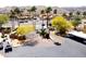 Entry to neighborhood with lush trees and parking, set against a backdrop of desert mountains at 3434 E Baseline Rd # 214, Phoenix, AZ 85042