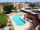 Aerial view showcasing the community pool with nearby covered parking areas at 3434 E Baseline Rd # 214, Phoenix, AZ 85042