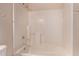 Clean bathroom with white tile, shower and bath combination at 3434 E Baseline Rd # 214, Phoenix, AZ 85042