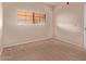 Bright bedroom with a window and plush carpeting at 3434 E Baseline Rd # 214, Phoenix, AZ 85042
