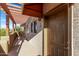 View of private entryway with awning and unit number on a condo building at 3434 E Baseline Rd # 214, Phoenix, AZ 85042