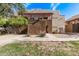 Condominium exterior featuring a private entrance, stucco facade, and landscaped front yard at 3434 E Baseline Rd # 214, Phoenix, AZ 85042
