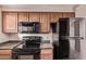 Updated kitchen featuring a black appliance package at 3434 E Baseline Rd # 214, Phoenix, AZ 85042