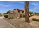 Community entrance featuring the Daybreak 3491 sign, mature plants, and well-maintained landscaping at 3491 N Arizona Ave # 118, Chandler, AZ 85225