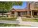 Charming home with a classic design, tiled roof, and well-manicured front lawn at 3491 N Arizona Ave # 118, Chandler, AZ 85225
