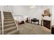 Bright living space with a cozy fireplace and a staircase leading to the loft at 3491 N Arizona Ave # 118, Chandler, AZ 85225