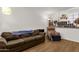 Cozy living room features a comfortable sofa and accent chair, plus a loft space above at 3491 N Arizona Ave # 118, Chandler, AZ 85225