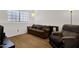Comfortable living room with a large window providing natural light at 3491 N Arizona Ave # 118, Chandler, AZ 85225