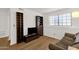 Modern living room features built-in shelving and a large window, creating a bright and airy space at 3491 N Arizona Ave # 118, Chandler, AZ 85225