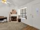 Inviting living area with a fireplace, large window, and ample natural light at 3491 N Arizona Ave # 118, Chandler, AZ 85225