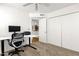 Carpeted office space featuring desk, chair, and closet at 3491 N Arizona Ave # 118, Chandler, AZ 85225