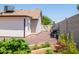 Spacious backyard featuring gravel, a garden bed, and privacy wall at 3605 W Pecos Rd, Chandler, AZ 85226